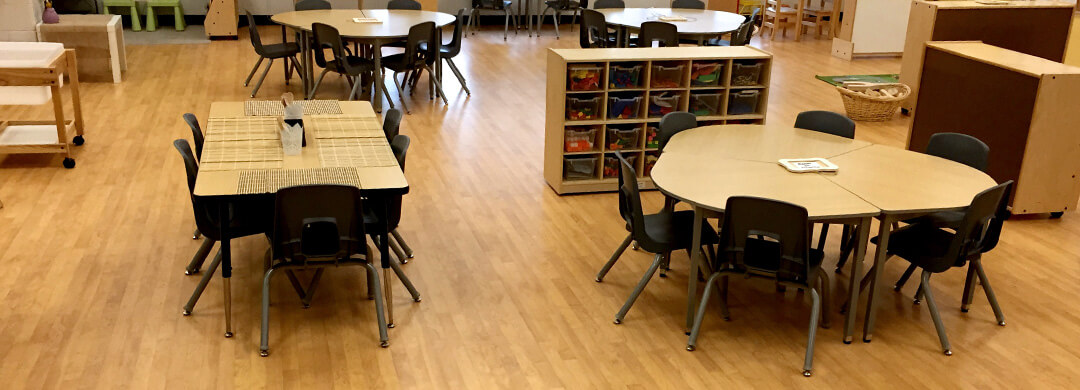 Kindergarten classroom with tables and chairs