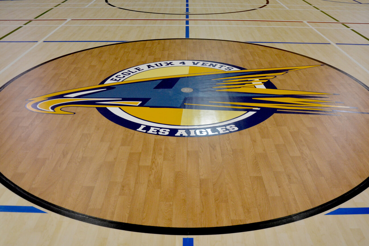 Central logo with specialised game line paint at Aux Quatre-Vents School (Mirabel, Quebec)