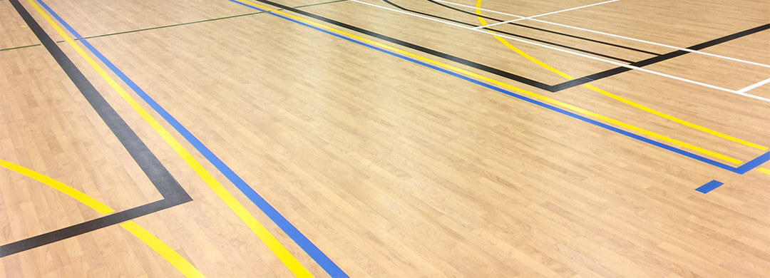 Surface of a vinyl floor installed in a school gymnasium