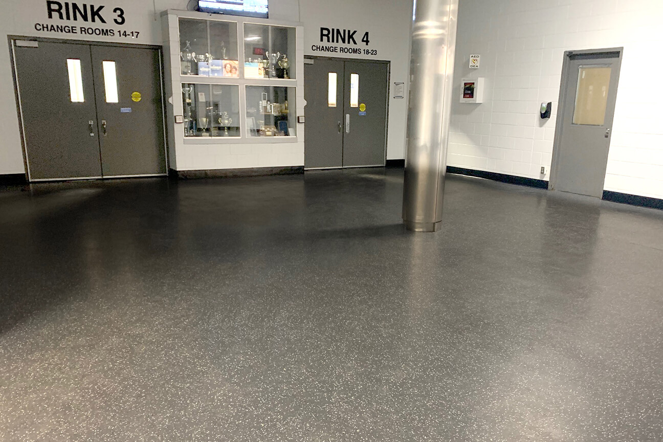 Meadowvale Four Rinks arena hallway with MaxFlor+, skate blade resistant rubber flooring (Mississauga, Ontario)