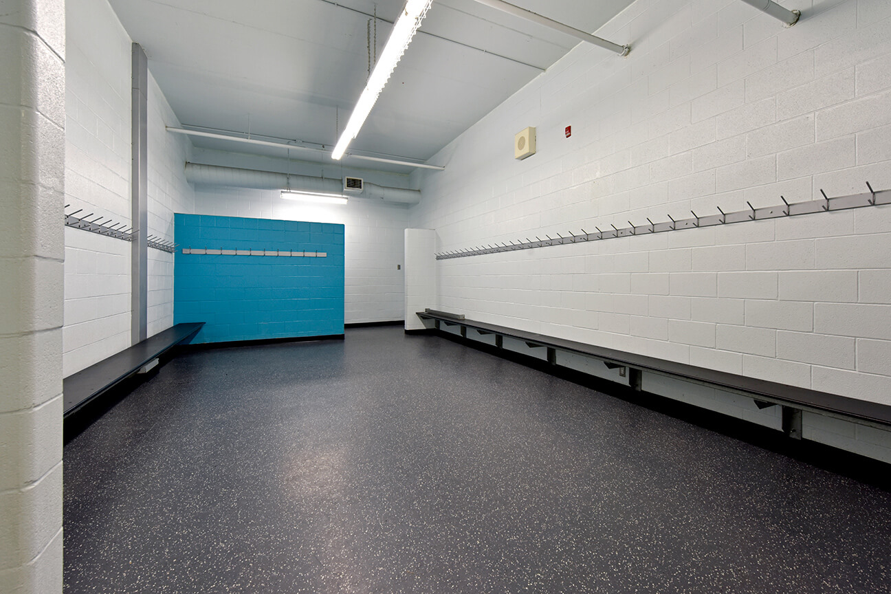 MaxFlor+ skate resistant flooring in arena changing room (Oakville, Ontario)