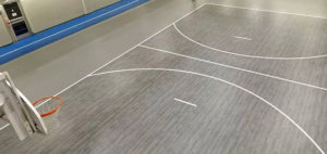 Omnisports flooring in small gymnasium with innovative colours