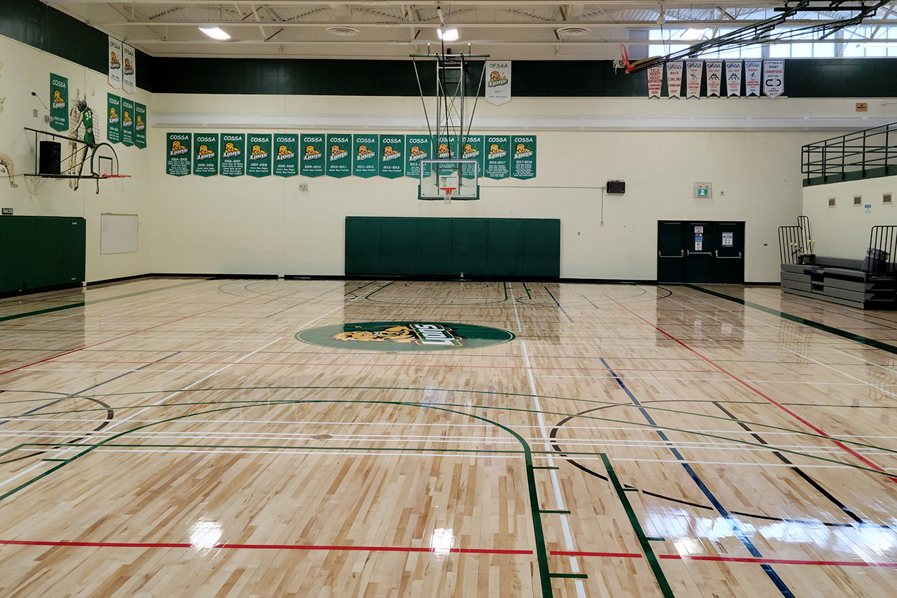 Refinished hardwood gymnasium flooring at Adam Scott Collegiate Vocational Institute (Peterborough, Ontario)