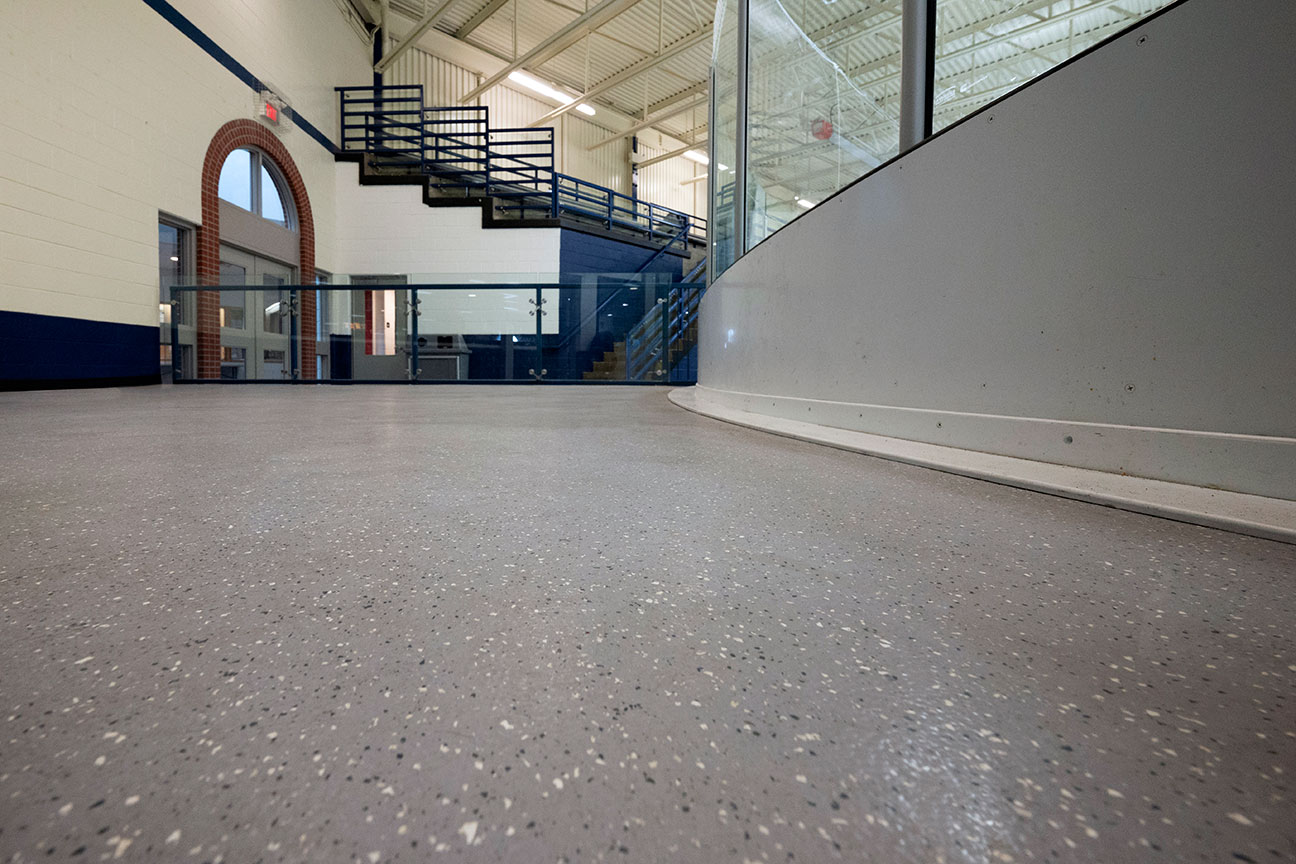 Rubber skate-resistant flooring around perimeter of ice rink (Richmond Hill, Ontario)