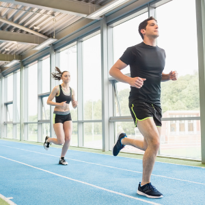 Athletes training on an indoor running track