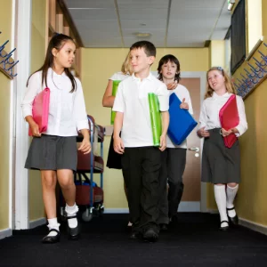 Students walking in a school hallway equipped with a resilient floor Students walking in a school hallway equipped with a resilient floor