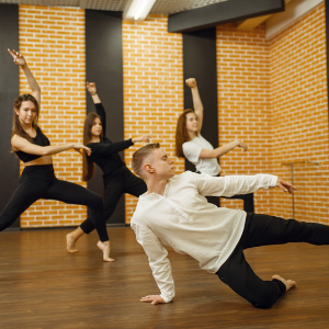 Dancers on a wood floor in a dance studio